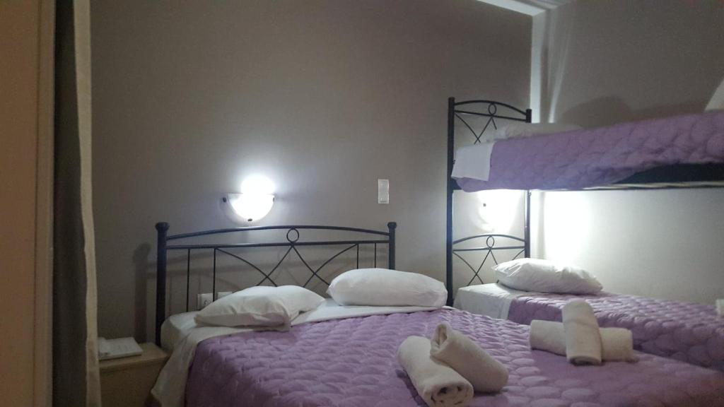 Ένα ή περισσότερα κρεβάτια σε δωμάτιο στο LUX Hotel