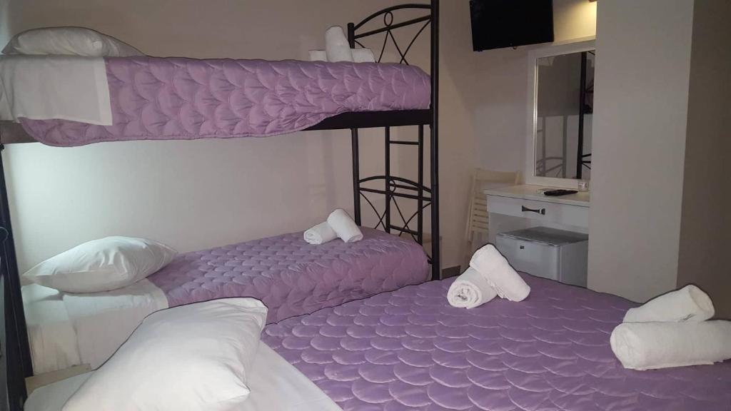 Ένα ή περισσότερα κρεβάτια σε δωμάτιο στο LUX Hotel