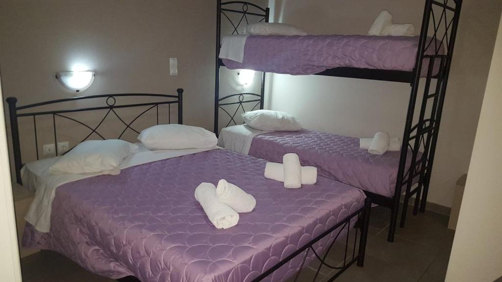 Ένα ή περισσότερα κρεβάτια σε δωμάτιο στο LUX Hotel