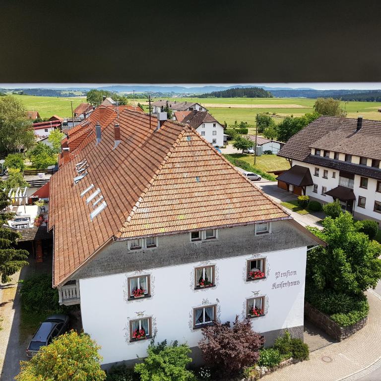 an overhead view of a white building with red roof at Pension Kaiserhaus in Ühlingen-Birkendorf