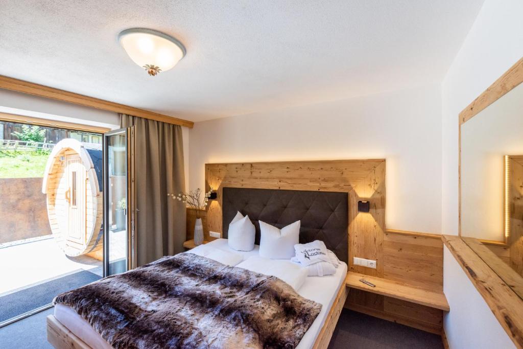 Postel nebo postele na pokoji v ubytování Viktoria Lodges