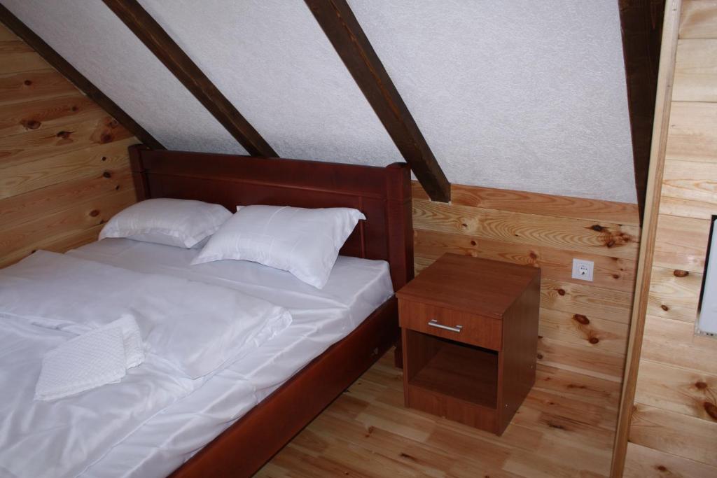 Postel nebo postele na pokoji v ubytování Apartmani Prisoje