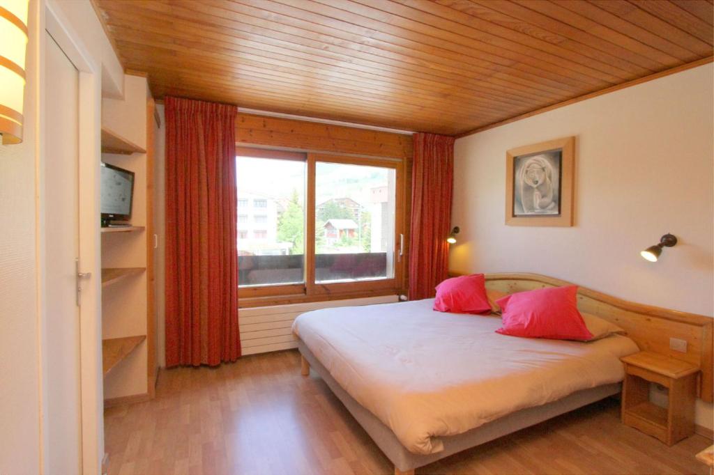 Postel nebo postele na pokoji v ubytování Hotel le Sherpa