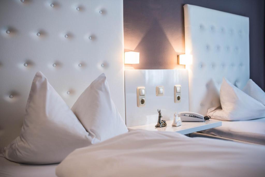 Postel nebo postele na pokoji v ubytování Hotel Domizil