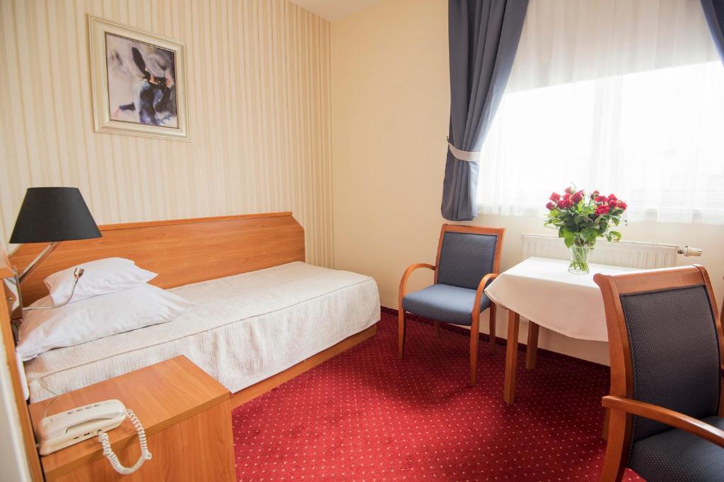 Postel nebo postele na pokoji v ubytování Hotel Daria