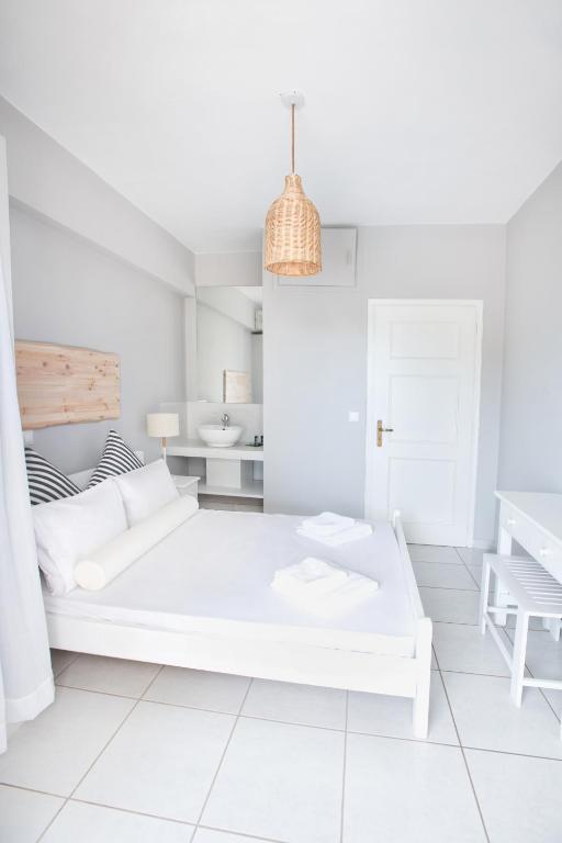 Postel nebo postele na pokoji v ubytování Akra Morea Hotel & Residences