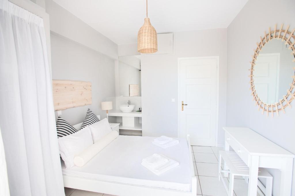 Postel nebo postele na pokoji v ubytování Akra Morea Hotel & Residences