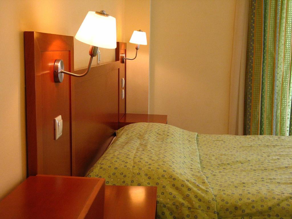 Postel nebo postele na pokoji v ubytování Artemis