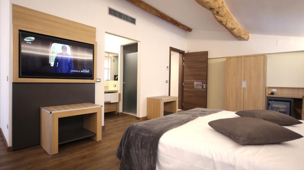 Postel nebo postele na pokoji v ubytování Hotel Corona