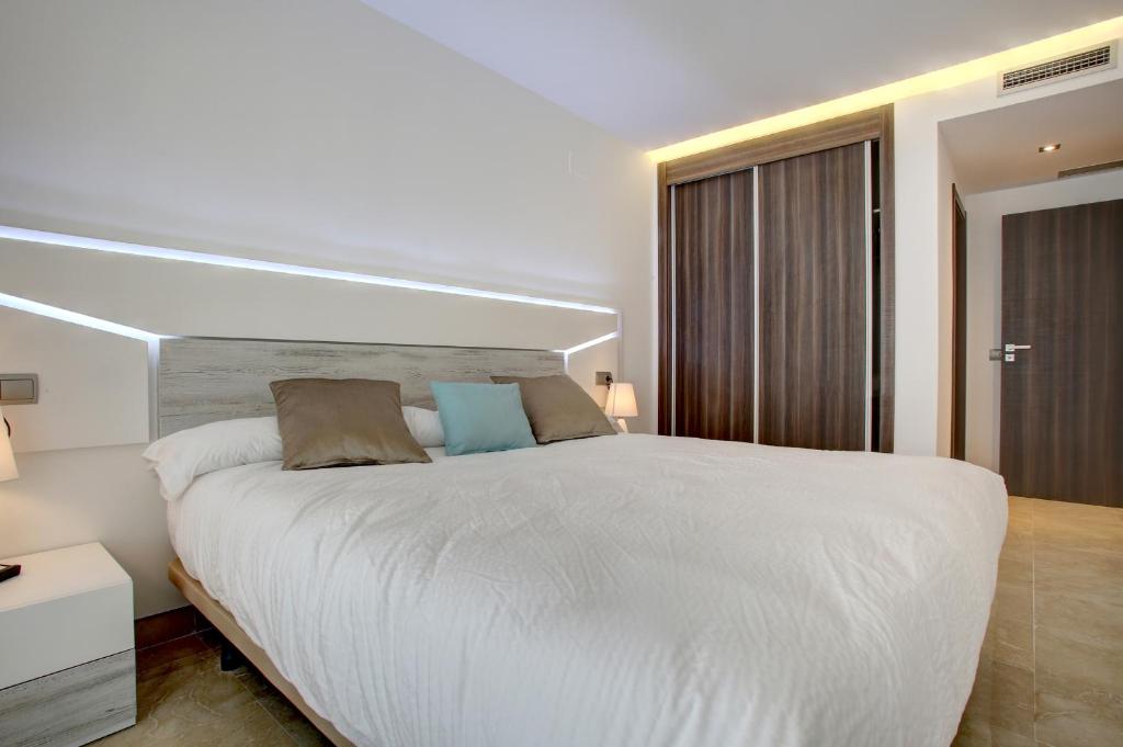 Cama o camas de una habitación en Aqua Apartments Marbella