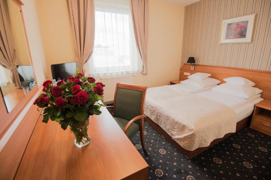 Postel nebo postele na pokoji v ubytování Hotel Daria