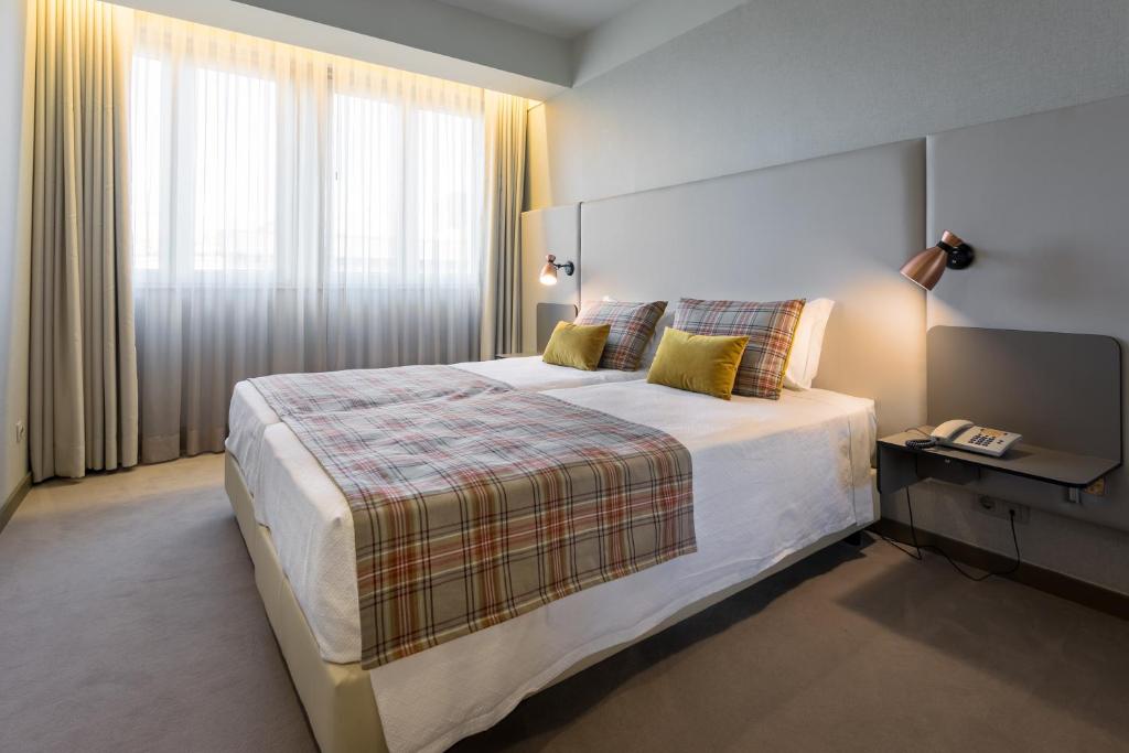 Un pat sau paturi într-o cameră la WOT Porto