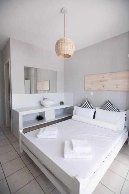 Postel nebo postele na pokoji v ubytování Akra Morea Hotel & Residences
