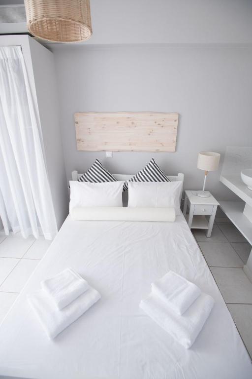 Postel nebo postele na pokoji v ubytování Akra Morea Hotel & Residences