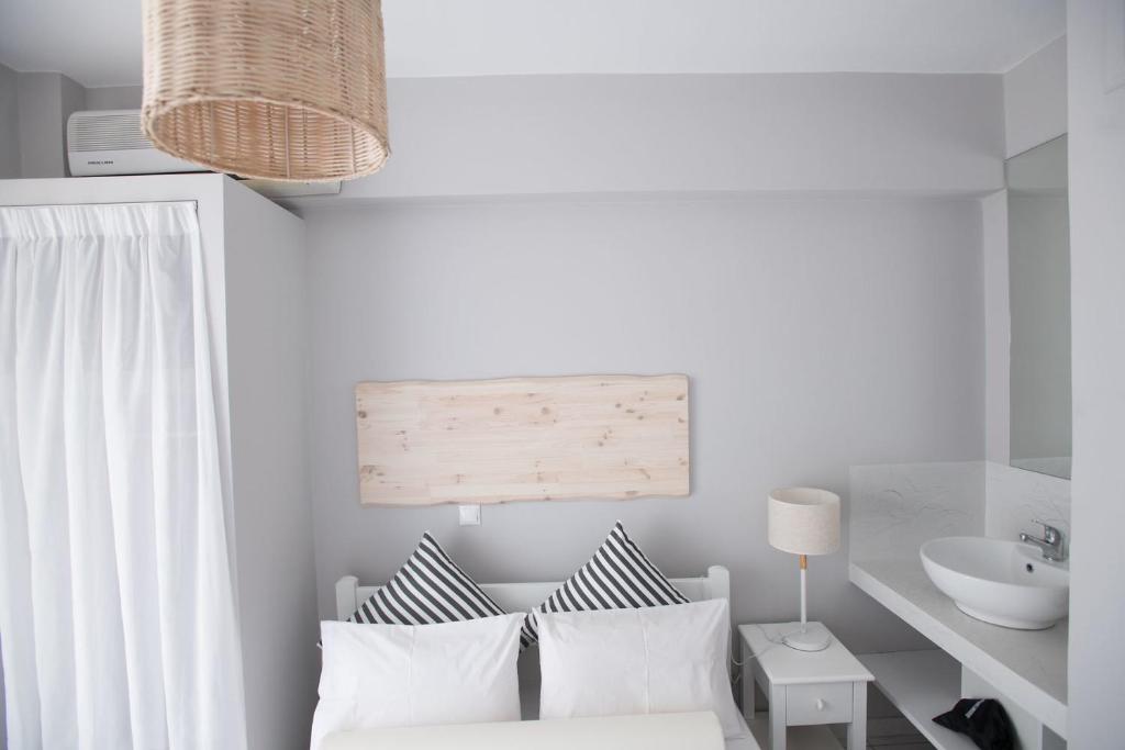 Postel nebo postele na pokoji v ubytování Akra Morea Hotel & Residences