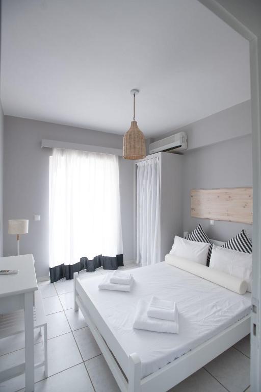 Postel nebo postele na pokoji v ubytování Akra Morea Hotel & Residences