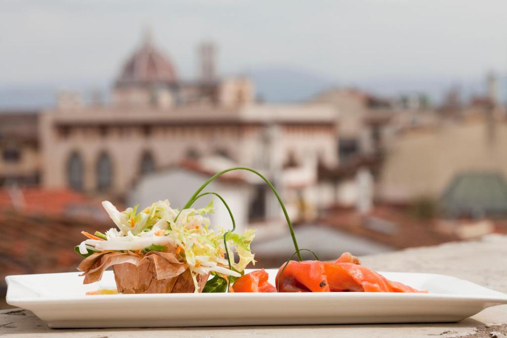 a plate of food sitting on a table at Hotel Kraft in Florence