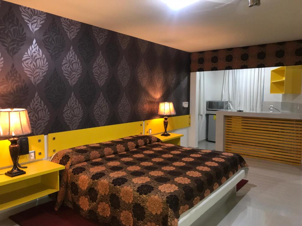 Postel nebo postele na pokoji v ubytování Palacio Rojo Hotel Familiar