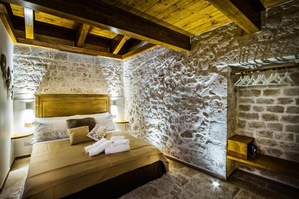 Postel nebo postele na pokoji v ubytování Beatrice rooms