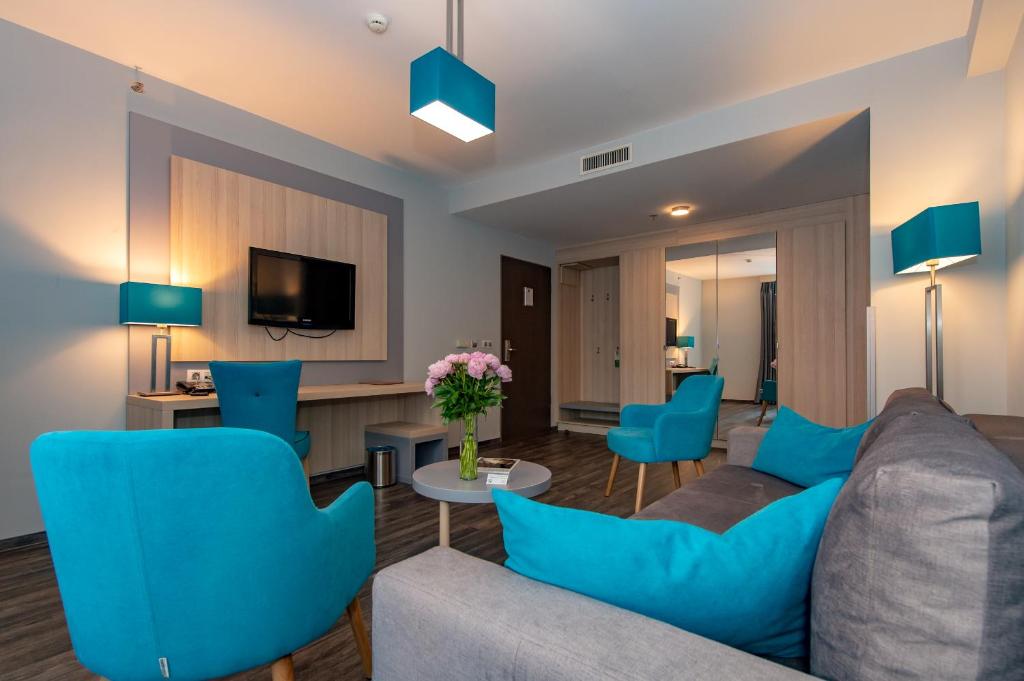 TV a/nebo společenská místnost v ubytování Hotel Regnum Residence