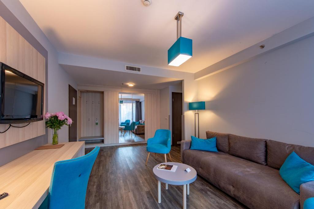 TV a/nebo společenská místnost v ubytování Hotel Regnum Residence