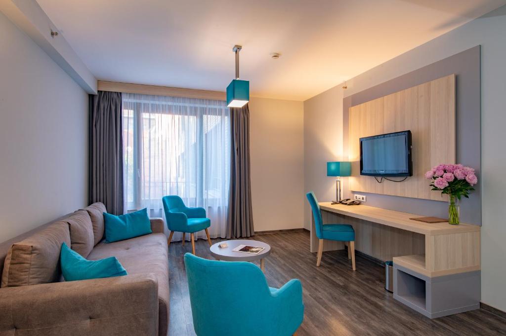 TV a/nebo společenská místnost v ubytování Hotel Regnum Residence