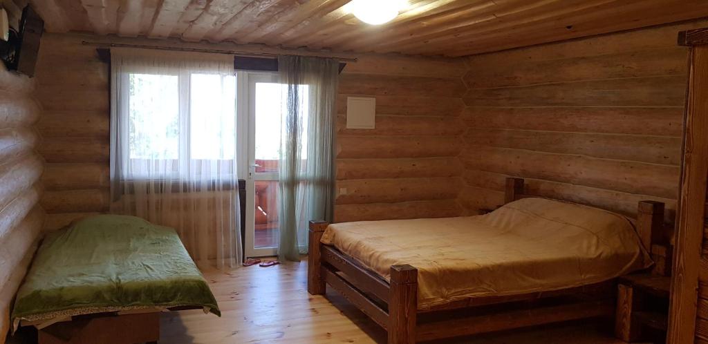 Postel nebo postele na pokoji v ubytování Эко-хаус