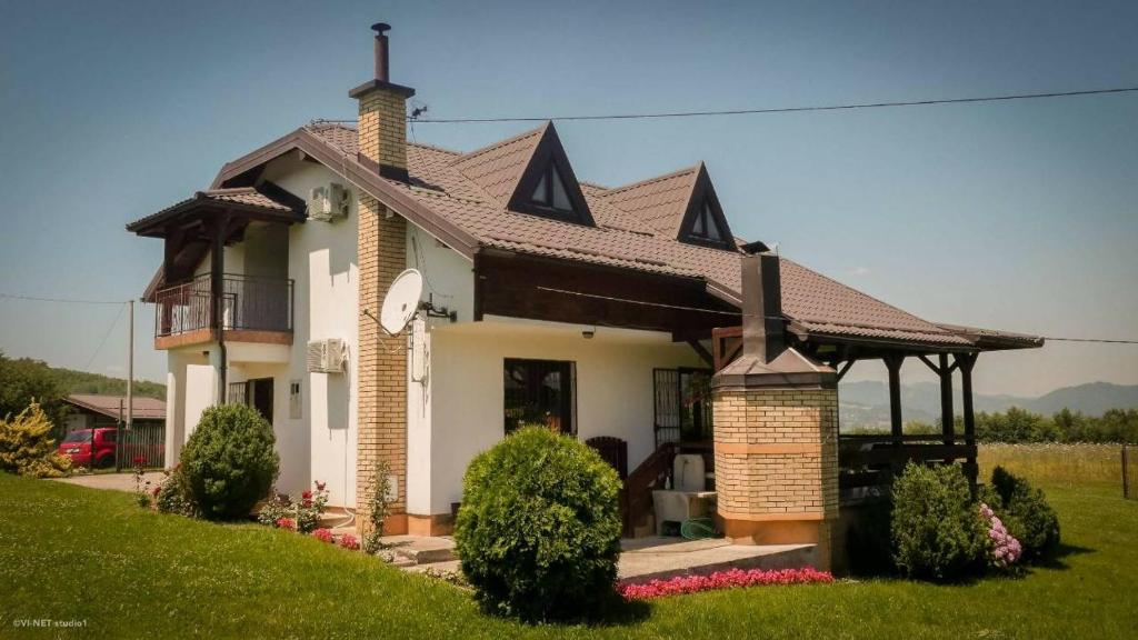 a house with a gazebo on a lawn at Green Forest Visoko in Visoko