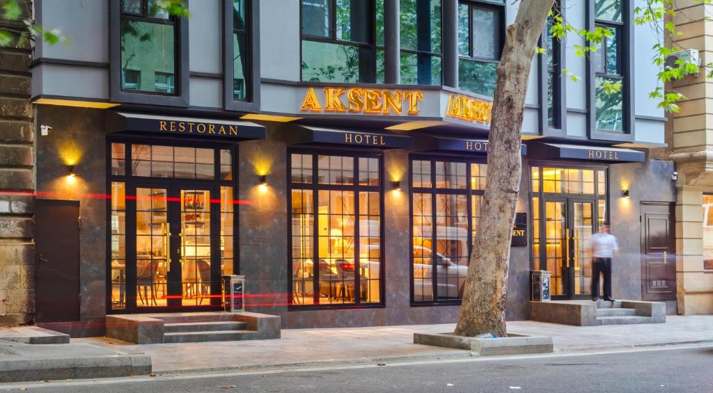 a store front of a restaurant on a city street at Aksent Hotel in Baku