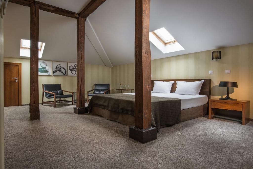 Postel nebo postele na pokoji v ubytování Boutique Hotel Uniqato