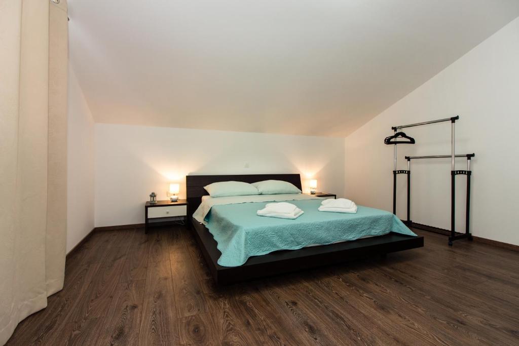Posteľ alebo postele v izbe v ubytovaní Apartment Villa Rina- Heated salt water Pool