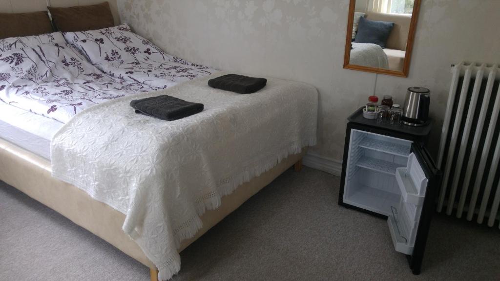 Postel nebo postele na pokoji v ubytování Guesthouse Sólgardar
