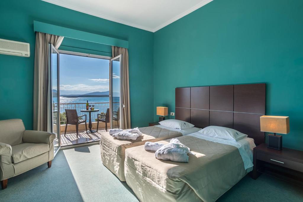 Postel nebo postele na pokoji v ubytování Galini Hotel