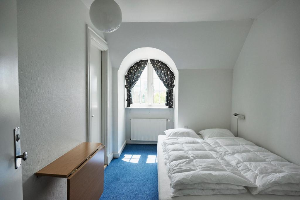 Letto o letti in una camera di Danhostel Odense City