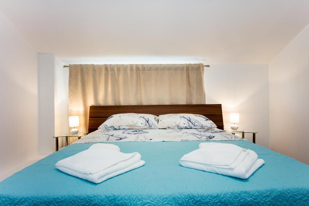 Posteľ alebo postele v izbe v ubytovaní Apartment Villa Rina- Heated salt water Pool
