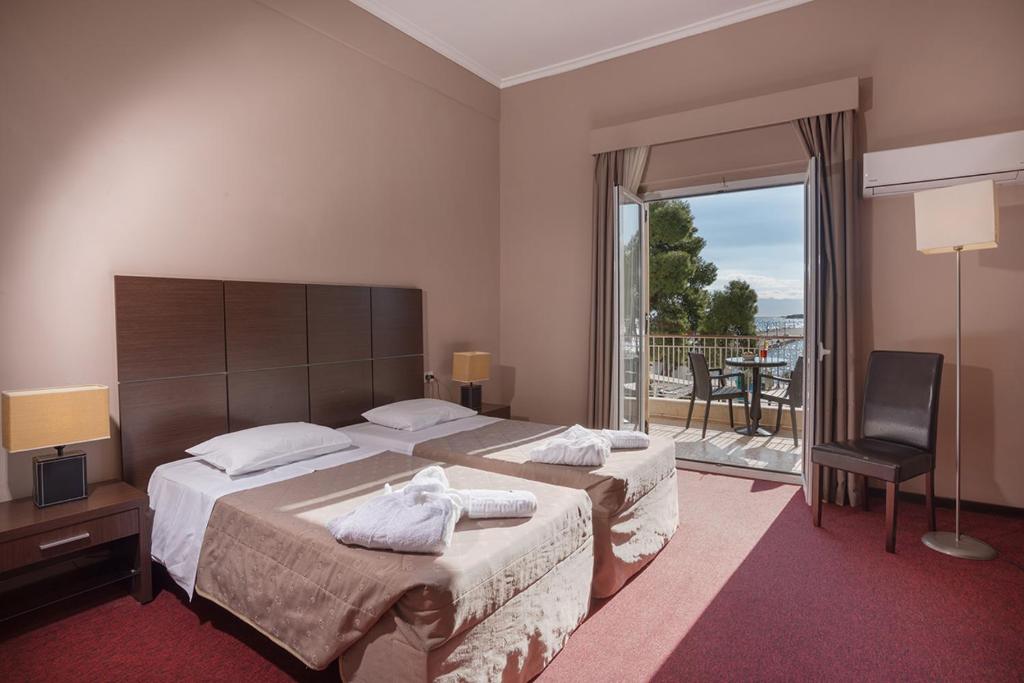 Postel nebo postele na pokoji v ubytování Galini Hotel
