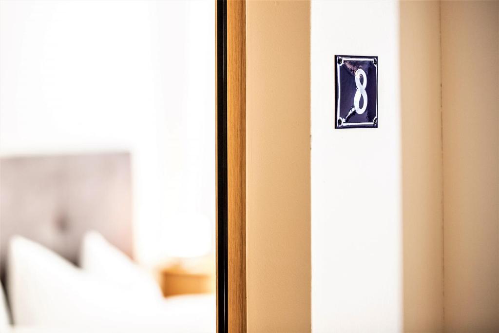 Postel nebo postele na pokoji v ubytování Hotel Münsterhof