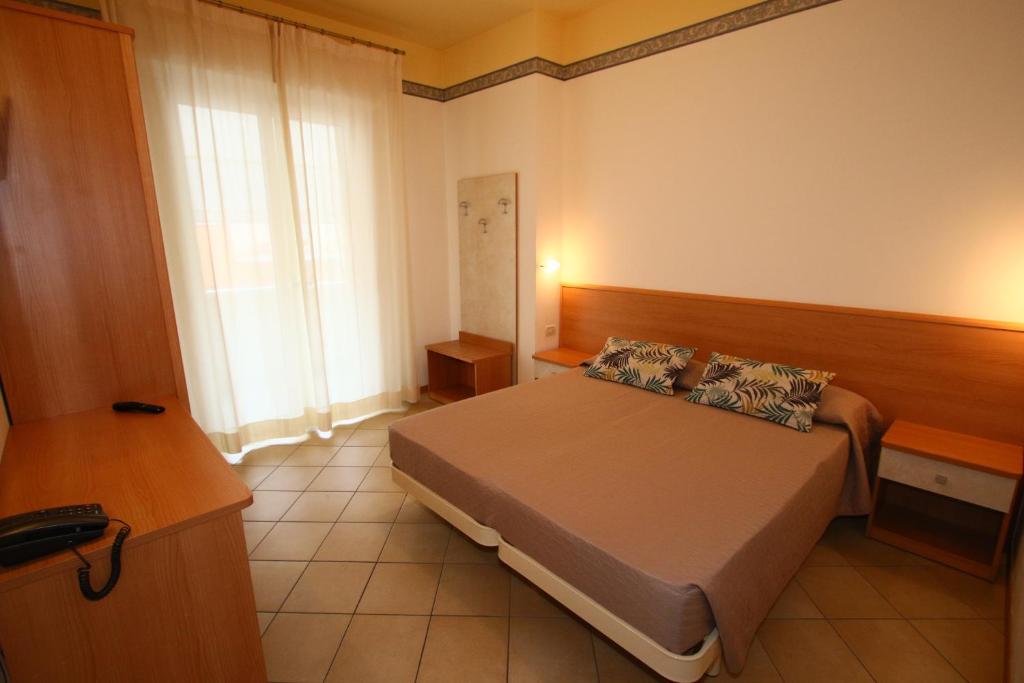 Postel nebo postele na pokoji v ubytování Hotel Boom