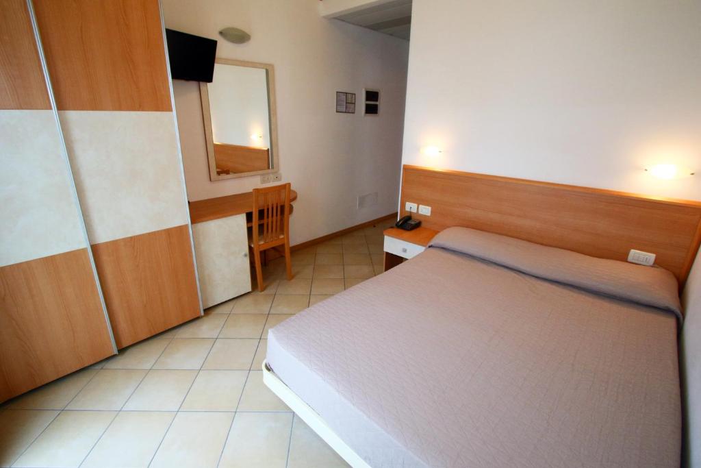 Postel nebo postele na pokoji v ubytování Hotel Boom
