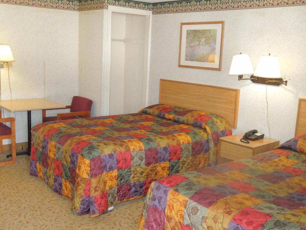 Postel nebo postele na pokoji v ubytování Red Lion Motel Southampton