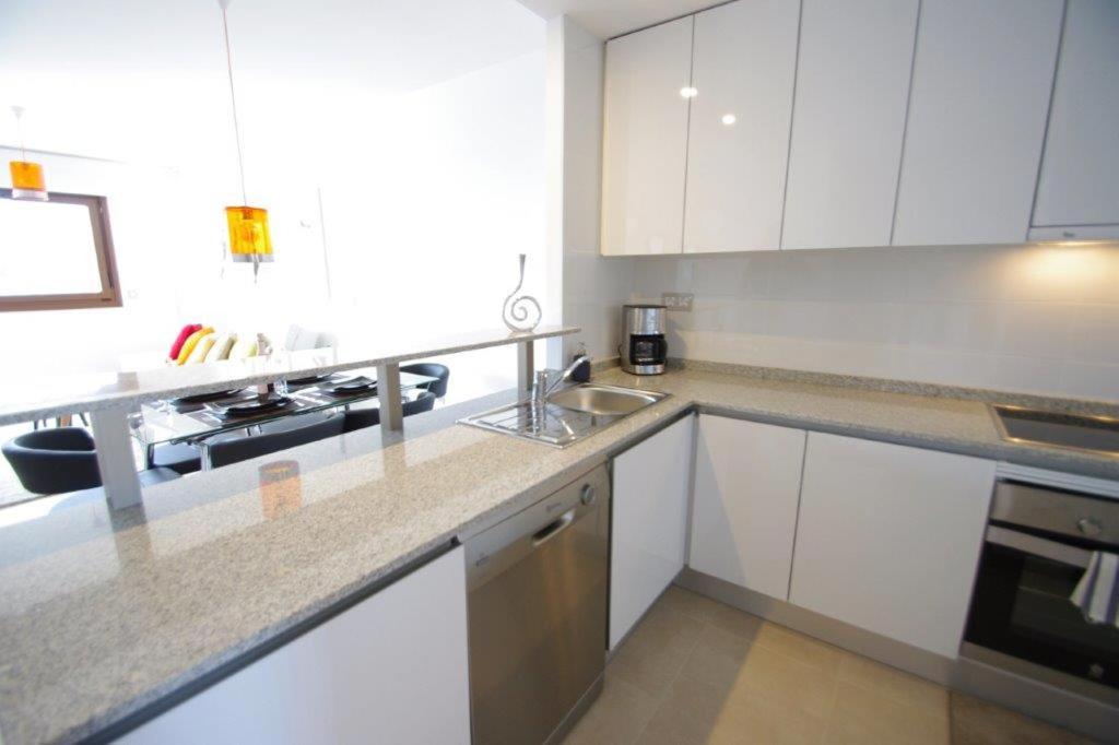 A kitchen or kitchenette at Oriuelha Costa Terrazas de Campoamor