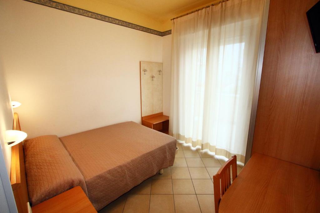Postel nebo postele na pokoji v ubytování Hotel Boom