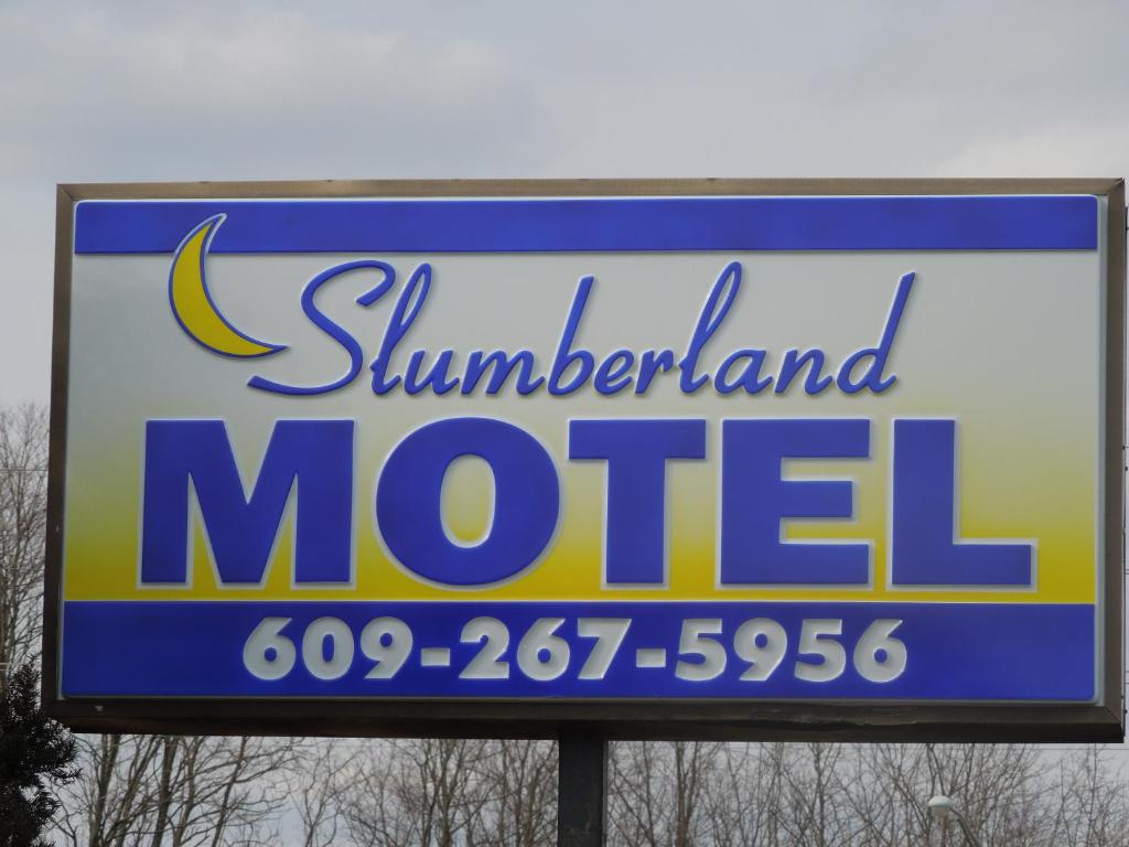 a billboard sign for a millerland motel at Slumberland Motel Mount Holly in Mount Holly