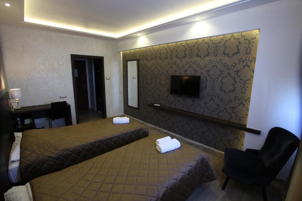 Postel nebo postele na pokoji v ubytování Hotel Petrus