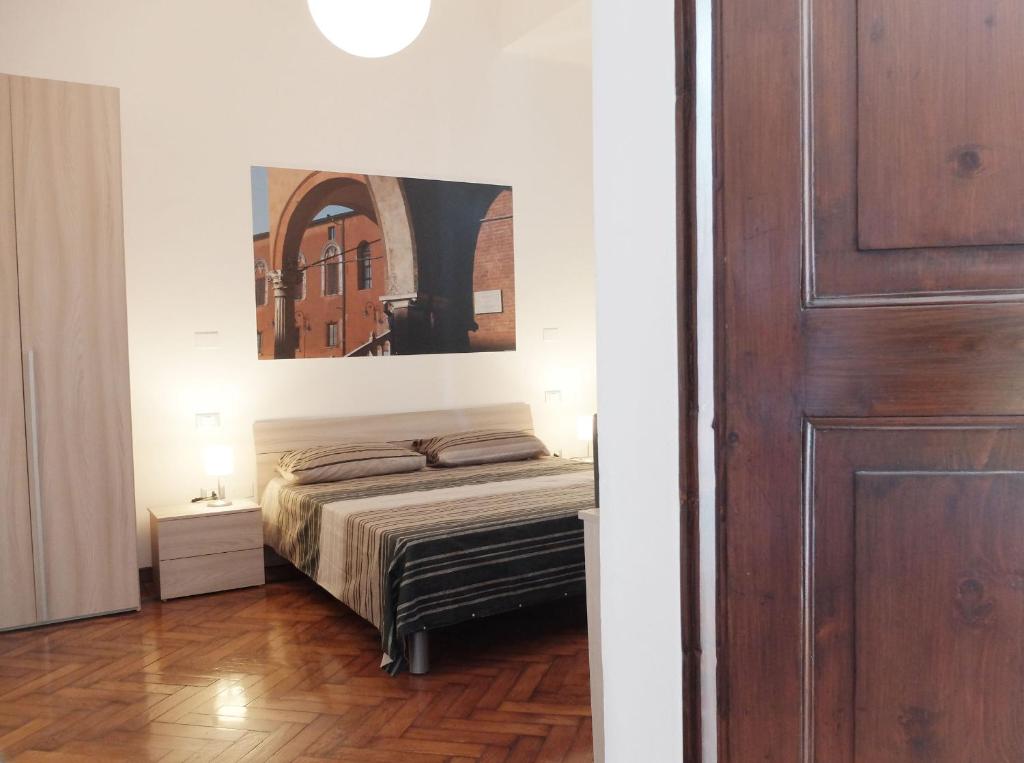 Postel nebo postele na pokoji v ubytování Centro Storico Suites