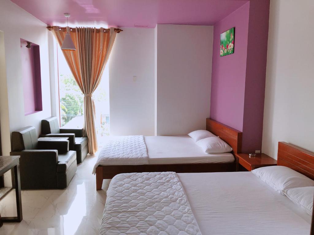 Giường trong phòng chung tại Ngoc Kha Tu 2 Hotel