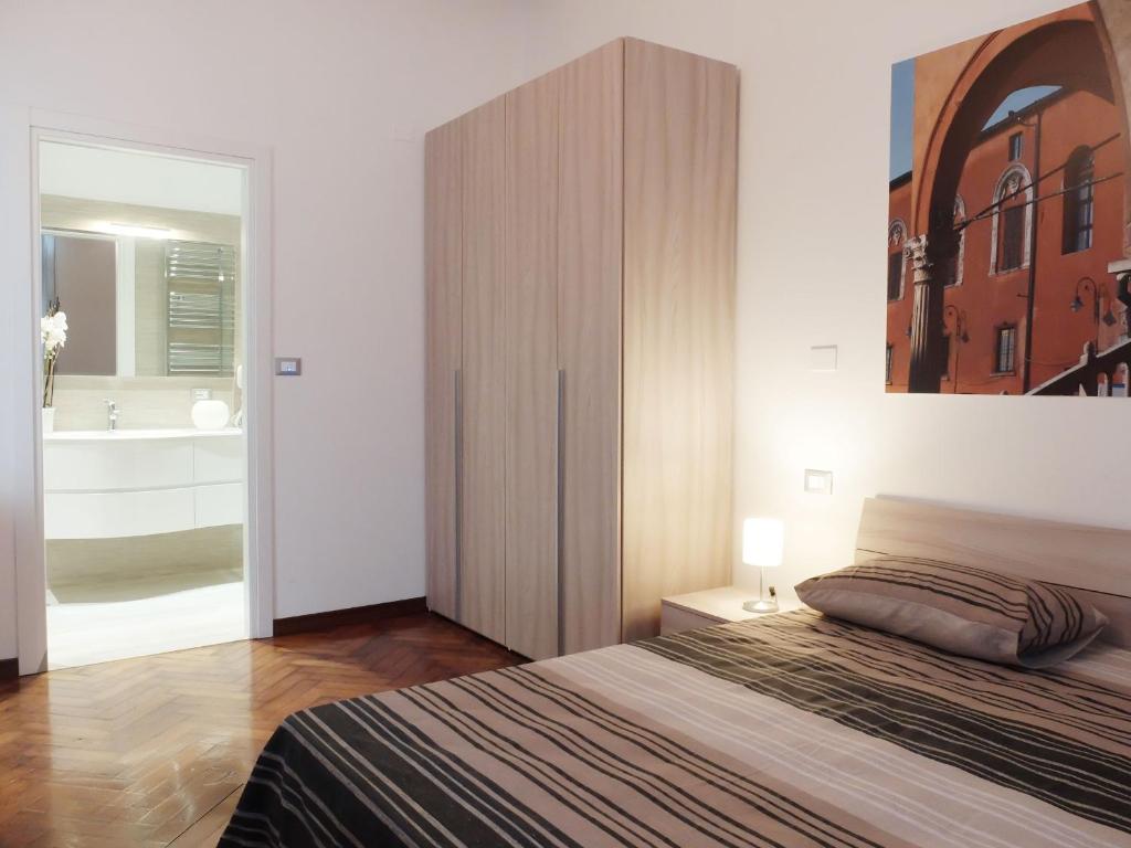 Postel nebo postele na pokoji v ubytování Centro Storico Suites
