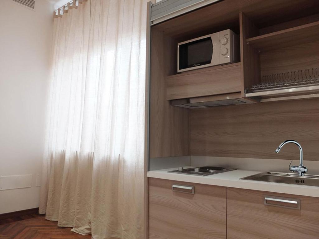Kuchyň nebo kuchyňský kout v ubytování Centro Storico Suites