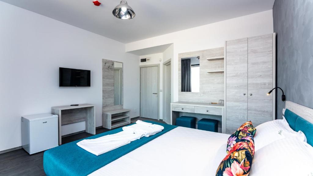Postel nebo postele na pokoji v ubytování Hotel H pe plaja Belona