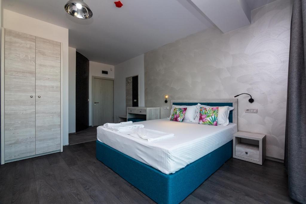 Postel nebo postele na pokoji v ubytování Hotel H pe plaja Belona